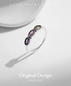 Detailed view of S925 silver ring featuring purple, pink, and yellow gemstones with elegant shadows
