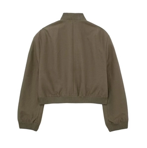 Detail of tan bomber jacket showing ribbed hem, cuffs and stand collar on white background