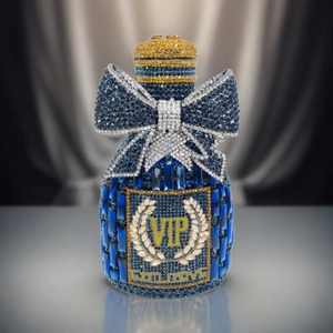 Luxury champagne bottle clutch bag with dark blue rhinestones and a large crystal bow