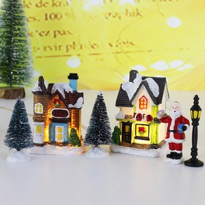 Luminous Christmas village set with resin houses, mini trees, and Santa Claus figurine