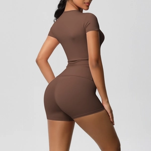 Detail view of high-elasticity dark brown yoga set showing fabric texture and tight fit