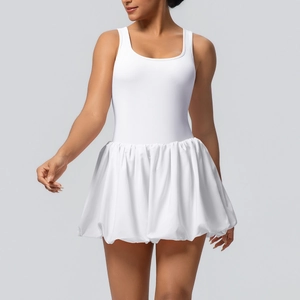 Close-up of white sleeveless athletic dress with pleated bubble hem for tennis