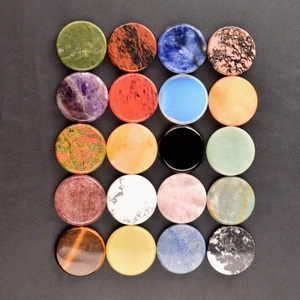 Detailed grid view of twenty colorful 40mm polished round natural crystal stone discs