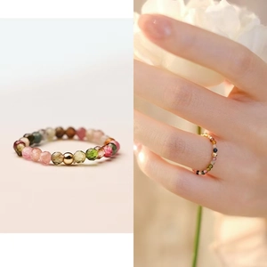 Detailed view of colorful tourmaline beaded ring with a central polished gold bead accent