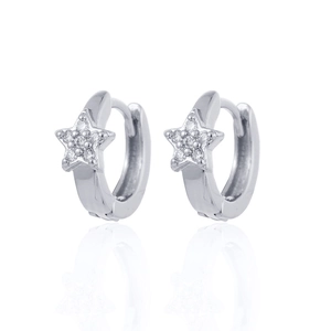 Macro detail of silver star huggie hoop earrings with sparkling white cubic zirconia stones