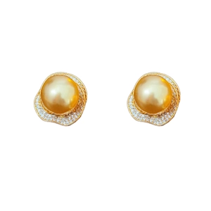 Elegant gold pearl stud earrings featuring a floral zircon halo on a clean white background