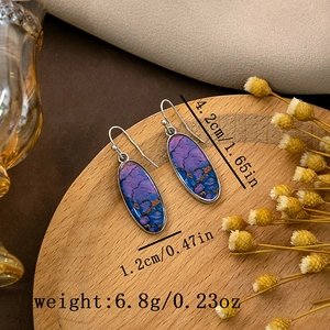 Detail view of retro oval earrings with turquoise texture and size dimensions in inches