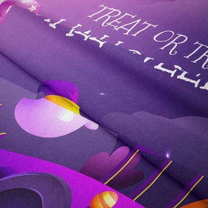 Macro shot of soft purple flannel Halloween tapestry fabric featuring festive text