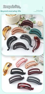 Detailed view of banana hair clips in matte and glossy finishes for ponytails