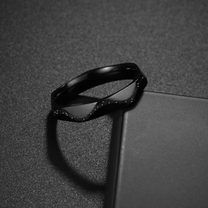 4mm black wedding band for women featuring wave-patterned frosted and polished finishes
