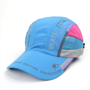 Detail of blue baseball cap showing mesh vents and pink skate style contrast panels