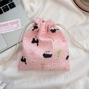 Detailed view of pink seersucker drawstring bag with cartoon cat and bow pattern