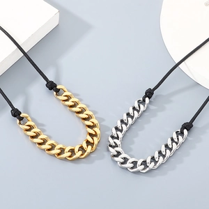 Detail of 13mm stainless steel Cuban chain necklaces with black wax rope in gold and silver