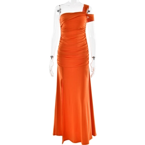 Detail view of orange one-shoulder evening dress with ruched design and side split