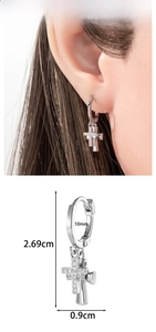 Macro detail of cross tassel earring with cubic zirconia and dimension labels