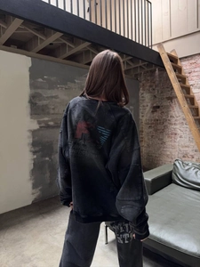 Oversized washed charcoal gray sweatshirt with graphic back print and street style vibe