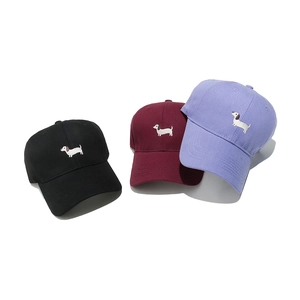 Three cotton baseball caps with dachshund embroidery in black, burgundy and light purple colors