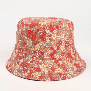 Orange floral bucket hat with daisy print for women, double-sided outdoor sun protection