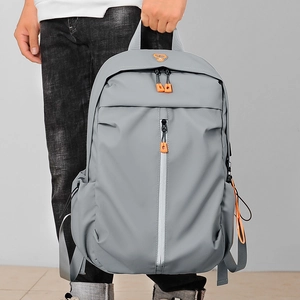 Men's grey business travel laptop backpack with stylish orange zipper detail