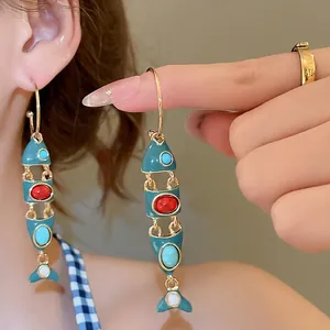 Bohemian gold fish tassel earrings with colorful stones and blue glaze inlay