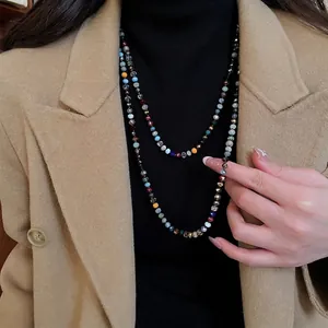 Bohemian multi-color crystal beaded necklace displayed on a model with black turtleneck
