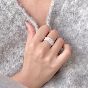 Minimalist 925 sterling silver multi-layer open ring shown on a hand with knitwear