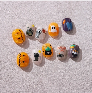 Detailed view of Halloween themed 3D nail stickers featuring pumpkins and ghosts