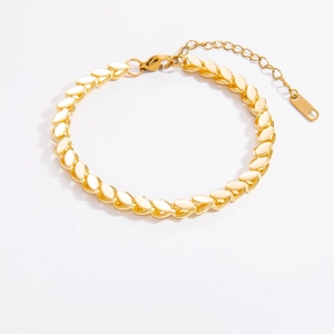 Detailed macro view of gold flat chain bracelet with lobster clasp and extension chain