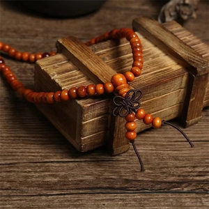 Classic 108 sandalwood-style prayer beads necklace with brown Chinese knot on antique box