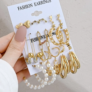 Vintage gold geometric earring set with pearls and rhinestones on fashion display card
