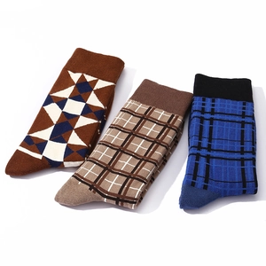 Three pairs of vintage plaid and geometric pattern cotton crew socks for men in various colors