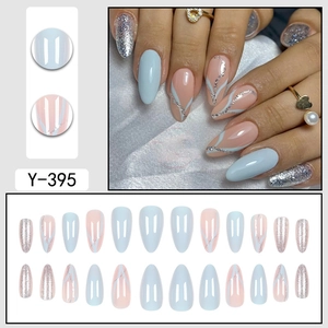 Blue almond fake nails set with silver glitter wave lines and solid light blue finish