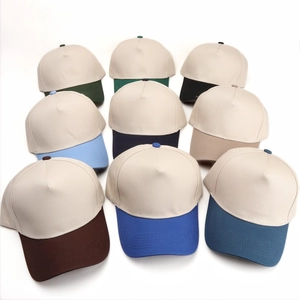 Five-panel baseball caps in beige with various colored brims arranged in 3x3 grid