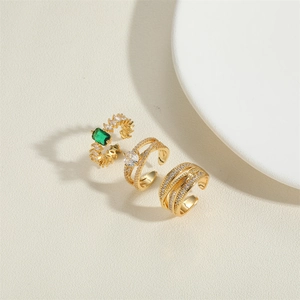 Three gold adjustable rings with green and white zircons in French vintage style
