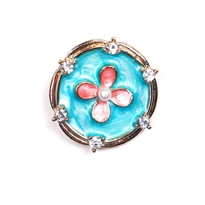 Floral turquoise enamel brooch with pink flower, pearls, and crystals in gold setting