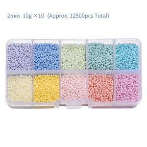 Detailed view of 2mm macaron glass seed bead set in a 10-compartment clear storage box