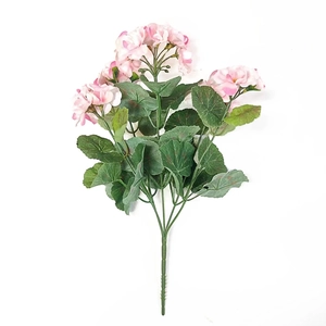 Close-up of pink artificial geranium flowers with realistic green leaves and silk petals
