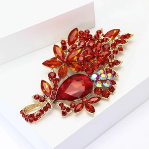 Detailed close-up of a high-end red crystal flower brooch with gold alloy base