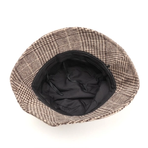 Detailed inside view of a vintage plaid woolen bucket hat with black lining and drawstring