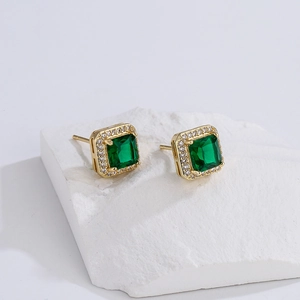 18K gold geometric snake stud earrings with green zircon and sparkling halo accents