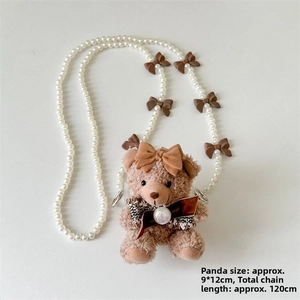 Brown plush bear pendant with faux pearl strap and cute ribbon details shown in detail