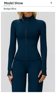 Detail of teal fitness jacket with thumbhole cuffs and functional full zipper design