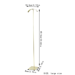 Detail of large gold metal display stand with dimensions 60.5cm height and 8x8cm base