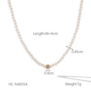Detail view of pearl necklace with golden diamond-set ring and product dimensions