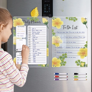 Girl writing on floral magnetic acrylic daily planner and to-do list for refrigerator