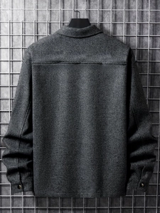 Detailed back view of dark grey corduroy jacket showing texture and metal buttons