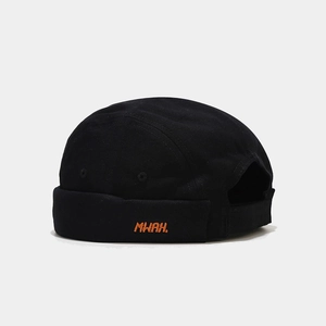 Close-up of vibrant orange MWAH embroidery on a black cotton canvas docker hat