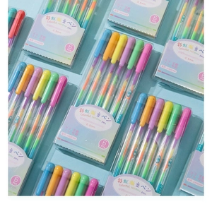 Detail view of 6-pack rainbow gradient glitter pens in clear storage cases