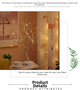 Detail of warm white LED tree lamp with adjustable silver branches and round base