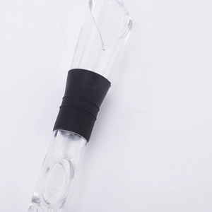 Close-up of a stainless steel wine aerator pourer with black rubber seal for wine bottles